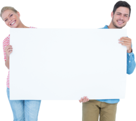 Smiling young couple holding a blank sign