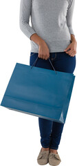 Woman holding blue shopping bag