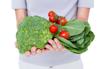 Woman holding vegetables