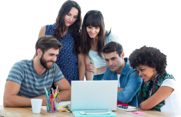 Happy creative business team gathered around a laptop