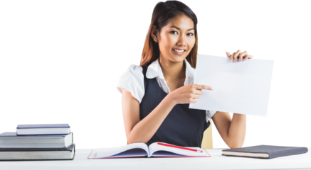 Smiling businesswoman pointing a sheet of paper