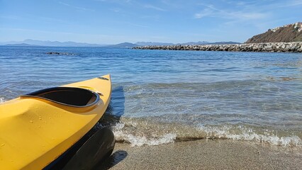 yellow kayak on the beach