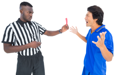 Referee showing red card to a player while holding whistle