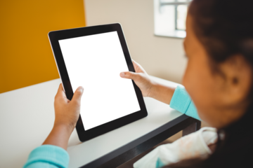 Girl sitting and using digital computer