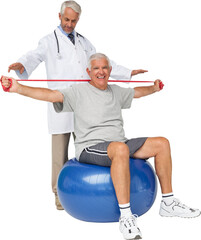 Mhysiotherapist looking at senior man sit on exercise ball with yoga belt