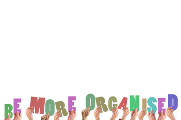 Cropped hands holding colorful words be more organised 