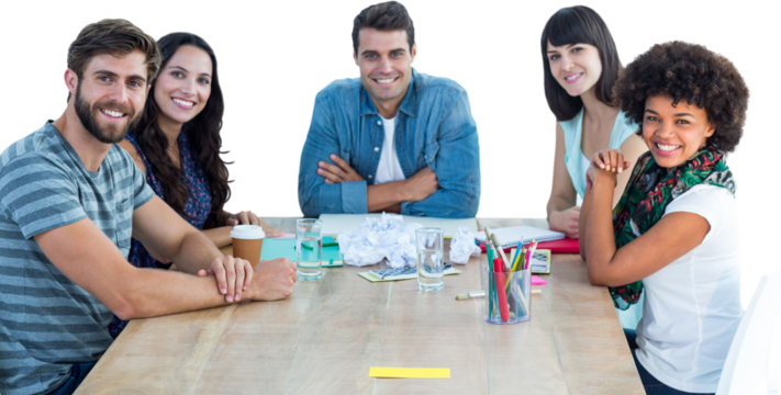 Happy creative business team looking at the camera 