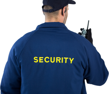 Rear view of security officer talking on walkie talkie