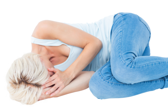 Sad blonde woman lying on the floor 