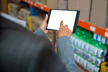Businesswoman touching screen of digital tablet