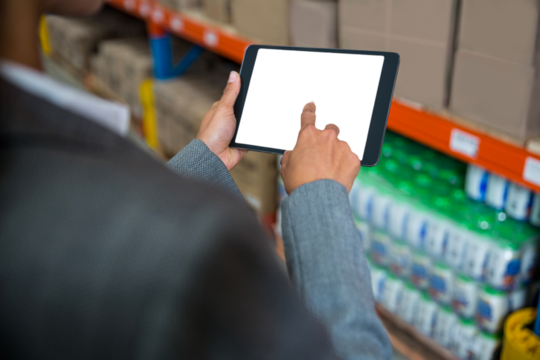 Businesswoman touching screen of digital tablet