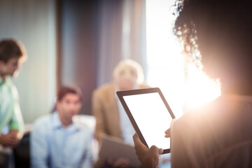 Businesswoman using digital tablet