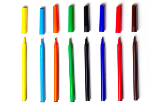 Many felt-tip pens in a row on a white background