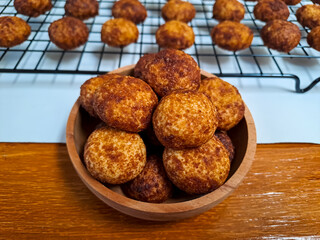Cheese palm ball cookies, made from flour and cheese, then coated with sweet crunchy palm sugar. Popular serving to celebrate Eid Al Fitr (Lebaran Idul Fitri). Selected focus
