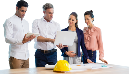 Male architect showing laptop to coworkers