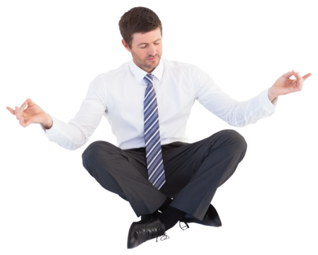 Businessman in suit sitting in lotus pose