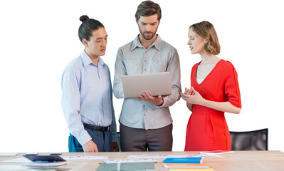 Coworkers discussing over laptop