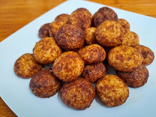Cheese palm ball cookies, made from flour and cheese, then coated with sweet crunchy palm sugar. Popular serving to celebrate Eid Al Fitr (Lebaran Idul Fitri). Selected focus
