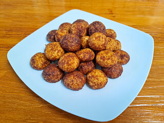 Cheese palm ball cookies, made from flour and cheese, then coated with sweet crunchy palm sugar. Popular serving to celebrate Eid Al Fitr (Lebaran Idul Fitri). Selected focus
