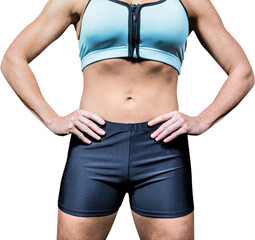 Midsection of powerful woman with hands on hip