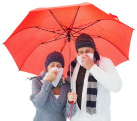 Mature couple blowing their noses under umbrella