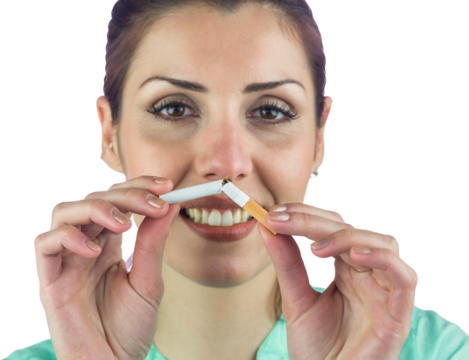 Close-up portrait of smiling woman holding cigarette 