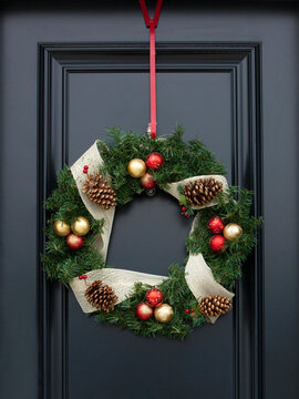 Christmas wreath on front door of home at Christmas time.