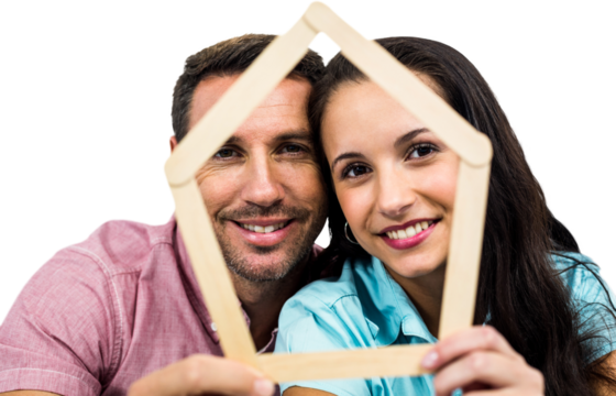 Young couple holding house shape