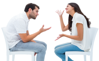 Couple sitting on chairs arguing