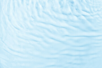 Waves on the surface of the water. gentle light waves, water, top view. Cyan, blue, transparent