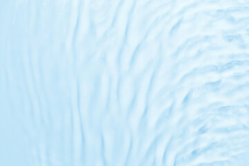 Waves on the surface of the water. gentle light waves, water, top view. Cyan, blue, transparent