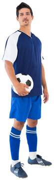 Football player holding ball