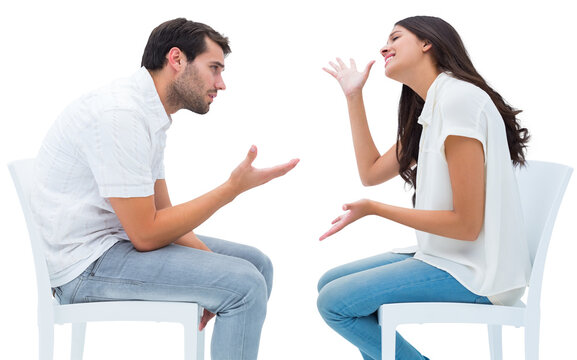 Couple sitting on chairs arguing