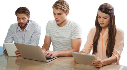Focused business people using technology against white background