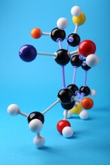 Obraz premium Structure of molecule on light blue background. Chemical model