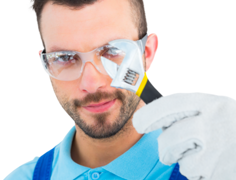 Repairman looking through adjustable wrench
