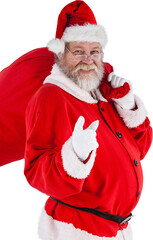 Portrait of Santa Claus pointing while carrying Christmas bag
