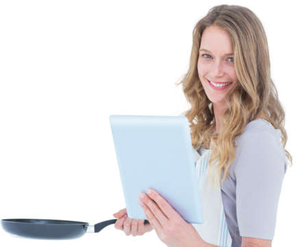 Smiling woman holding frying pan and tablet pc - Powered by Adobe
