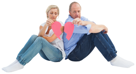 Sad mature couple holding a broken heart