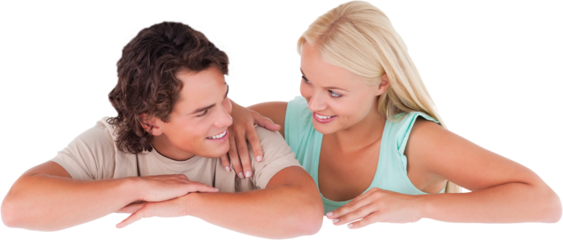 Cute happy couple leaning on a whiteboard