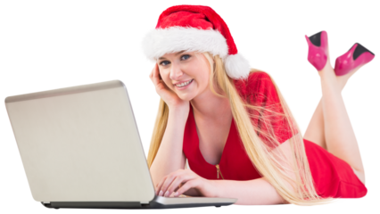 Festive blonde using a laptop