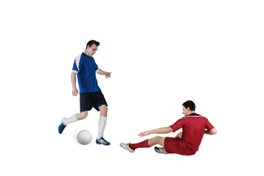 Football players tackling for the ball