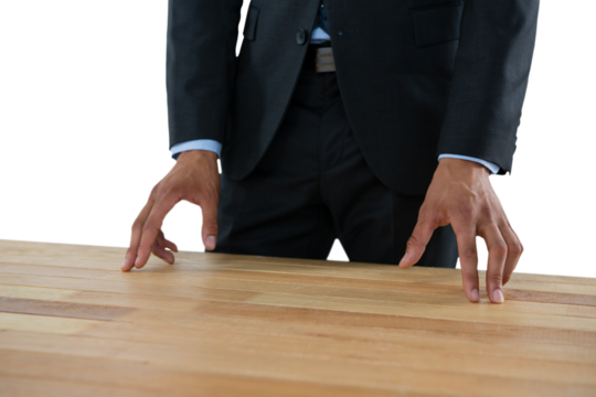 Close up of businessman gesturing while standing at table