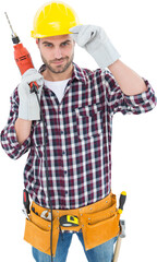 Confident handyman holding drill machine