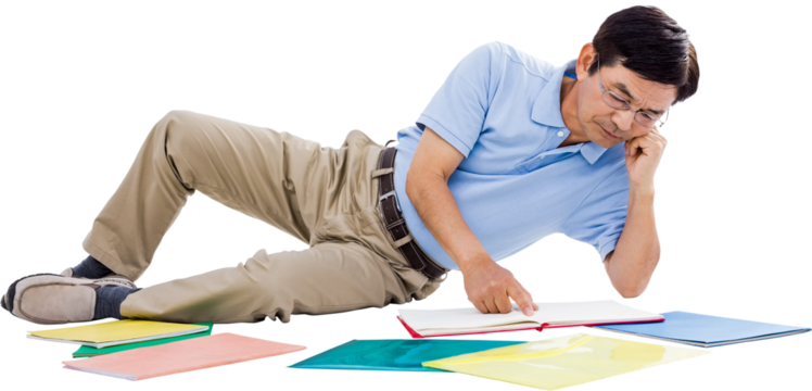 Smiling man reading books - Powered by Adobe