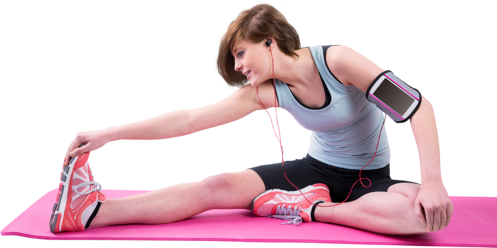 Pretty brunette doing the hamstring stretch on exercise mat