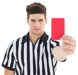 Portrait of stern referee showing red card