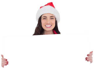 Smiling brunette in santa hat showing white poster