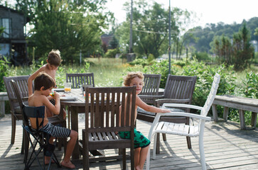 children on beach patio