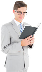 Geeky businessman reading black book